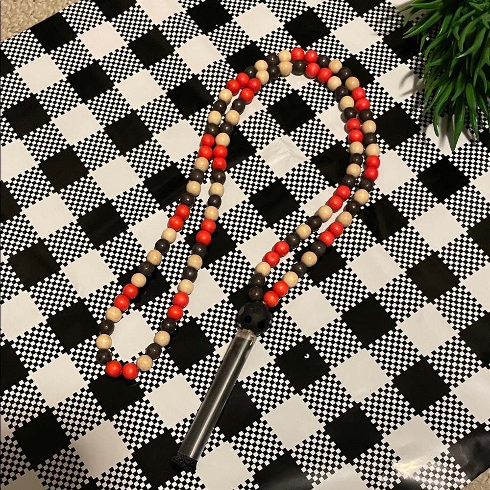 Hand assembled beaded necklace silk tassel